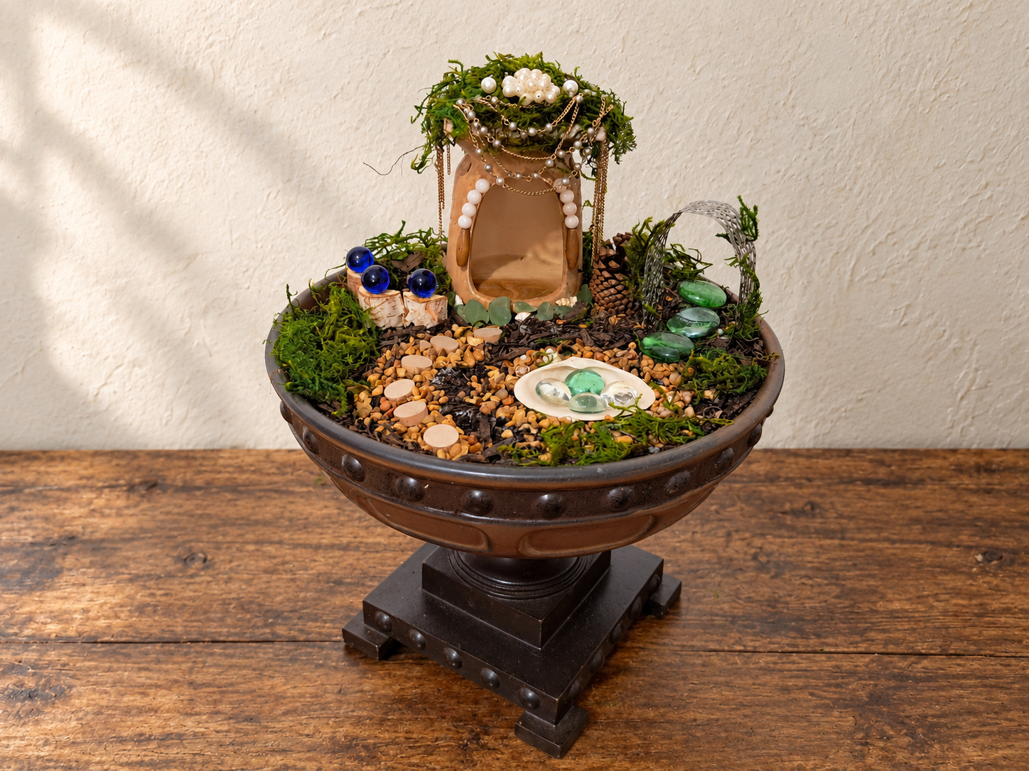 The decorated fairy house returned to the evolving pedestal-bowl fairy world