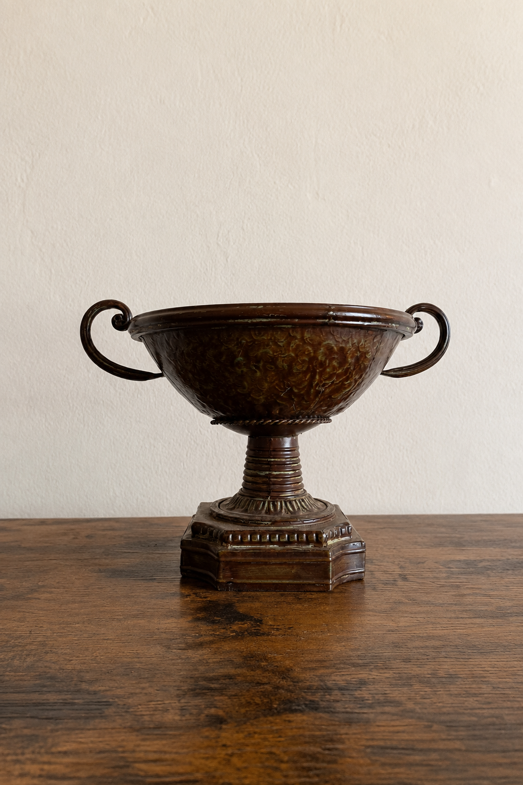 An ornate handled pedestal bowl prepared for a fairy jewel garden